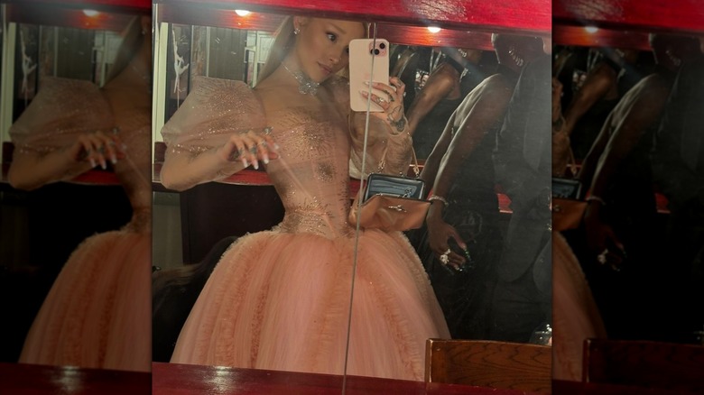 Ariana Grande wears a Glinda-inspired latex gown to the Sydney premiere of "Wicked."