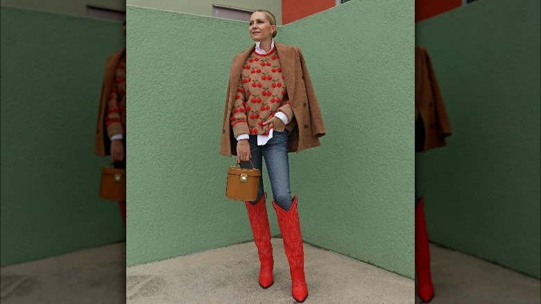 woman wearing red cowboy boots