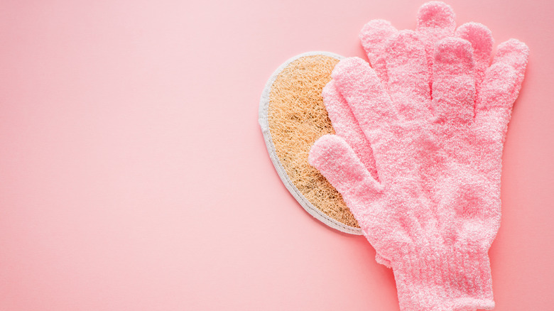A pair of pink exfoliating gloves