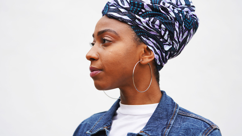 A woman wearing big hoop earrings