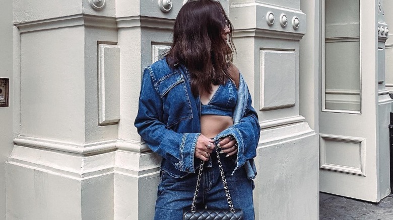 A woman wearing matching denim