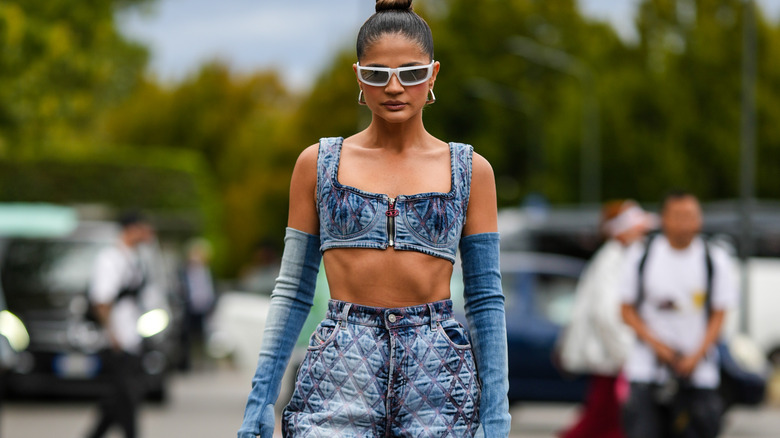 A woman wearing faded denim