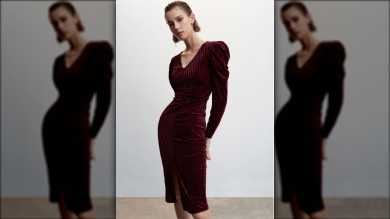 Model wearing burgundy velvet dress