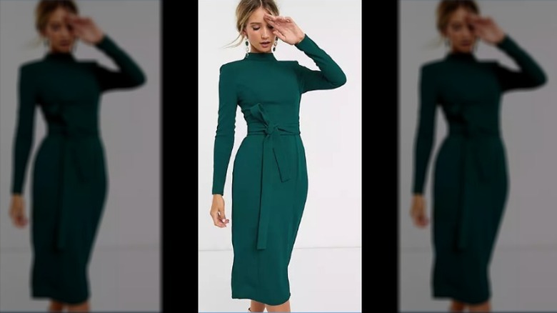 Model wearing green belted dress