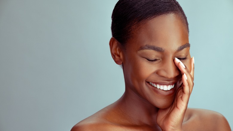 Woman with glowing skin smiling