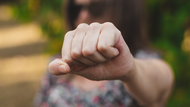 Woman with closed fist 