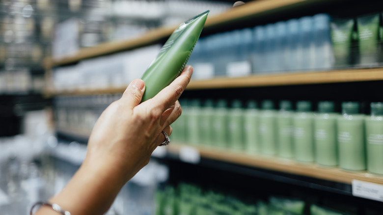 woman holding beauty item