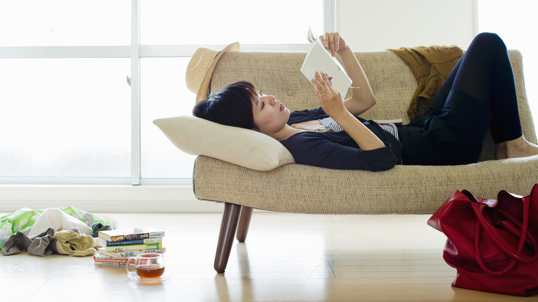 woman laying on couch