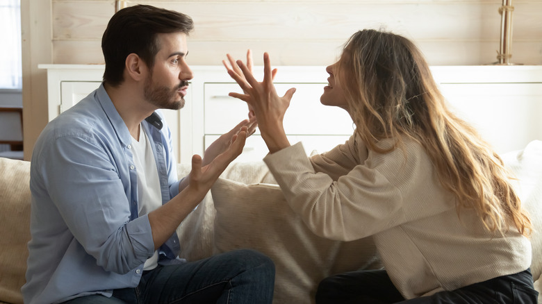 couple arguing on couch