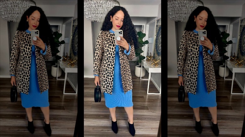 woman wearing cheetah print jacket over blue fitted dress