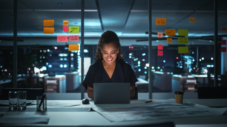 woman working in office at night