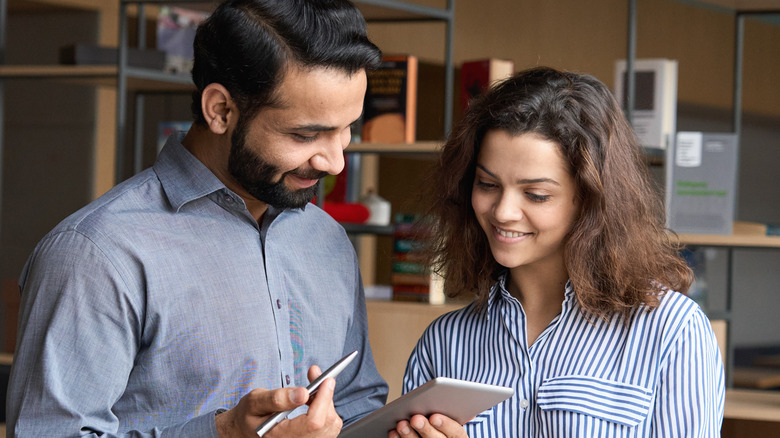 man and woman working together