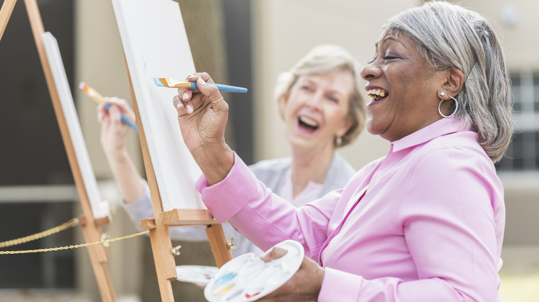 happy relaxed women painting