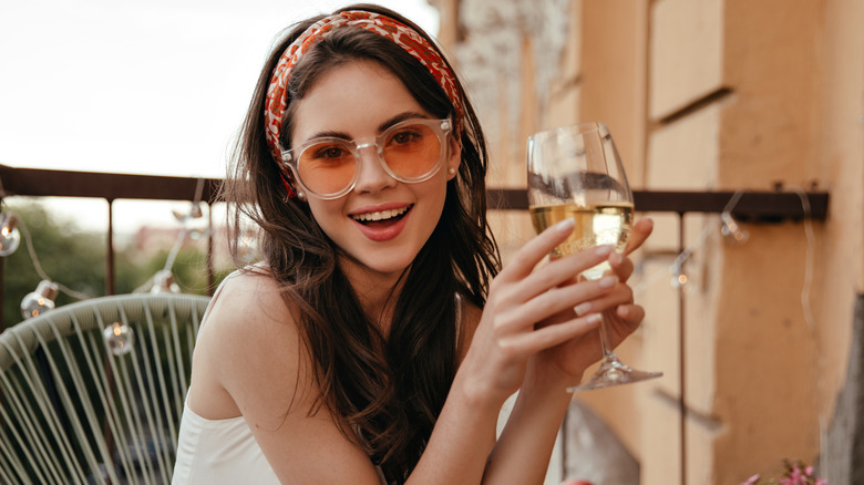 woman holding a glass of wine