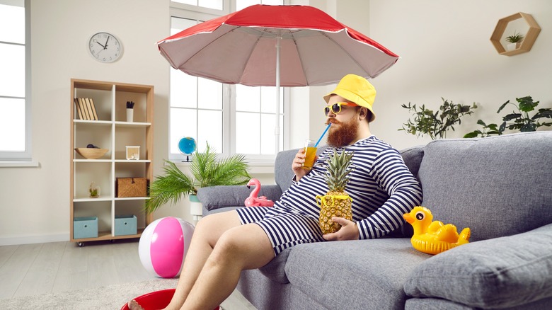 man enjoying beach day at home