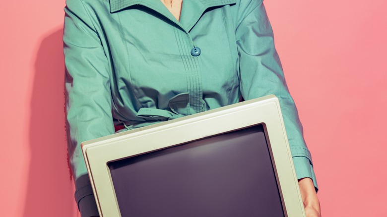 woman holding computer