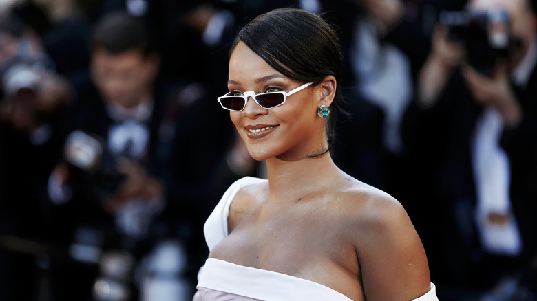 Rihanna wearing white sunglasses 