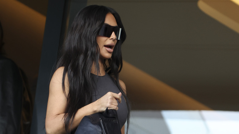 Kim Kardashian wearing black sunglasses 