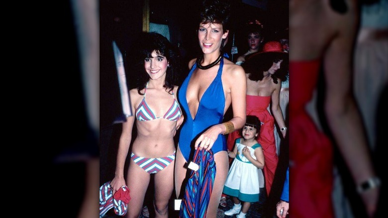 Jamie-Lee Curtis wearing an 80s swimsuit