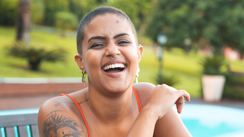 Woman smiling with piercings