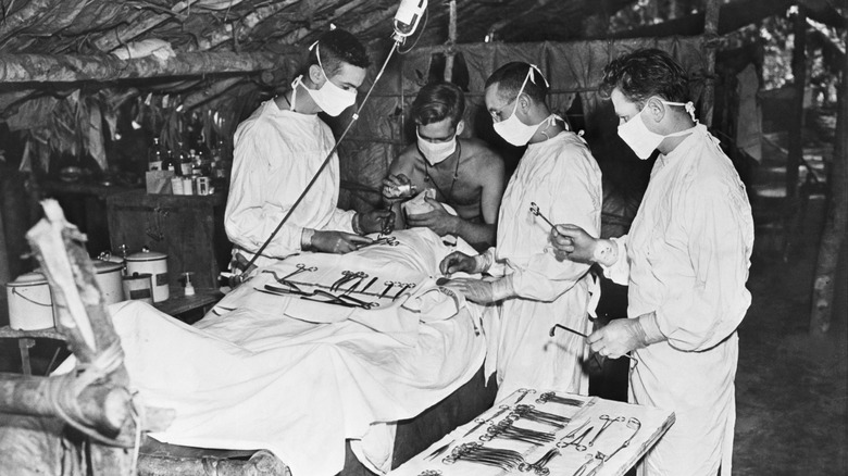 surgeons gathering around surgery table