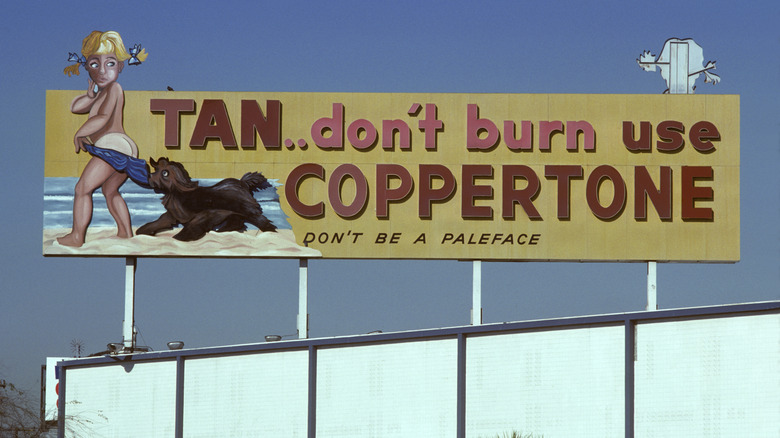 A billboard advertising 'Coppertone' suncreen lotion
