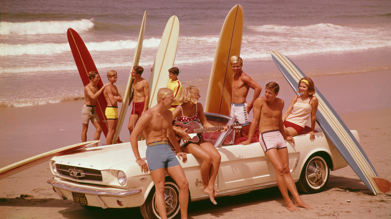 A group of surfers at the beach