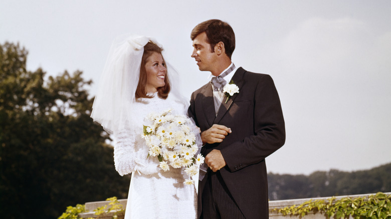 Bride with bouffant hair and groom