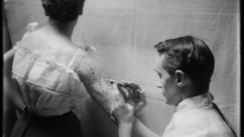 woman getting tattoed
