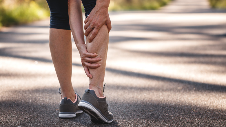 Woman with calf cramp 