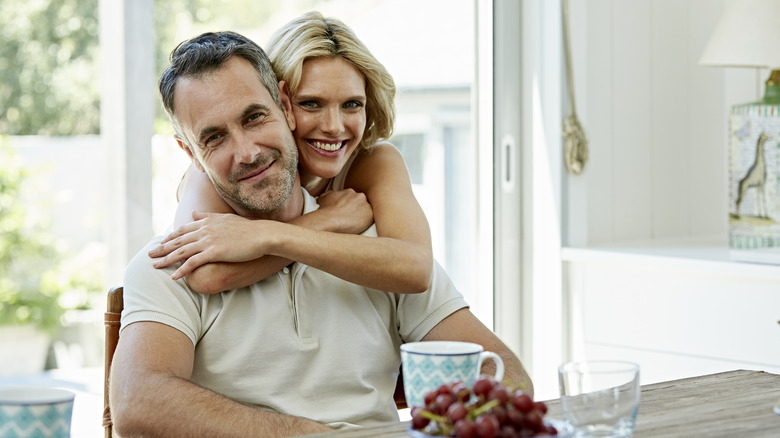 Woman hugging man from behind