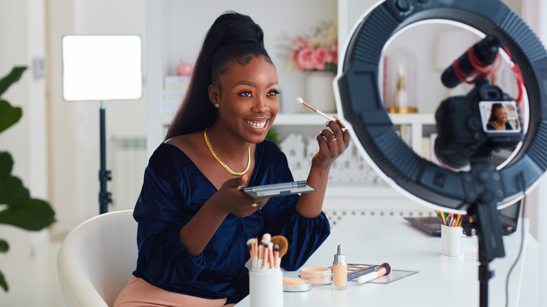 Woman doing makeup tutorial