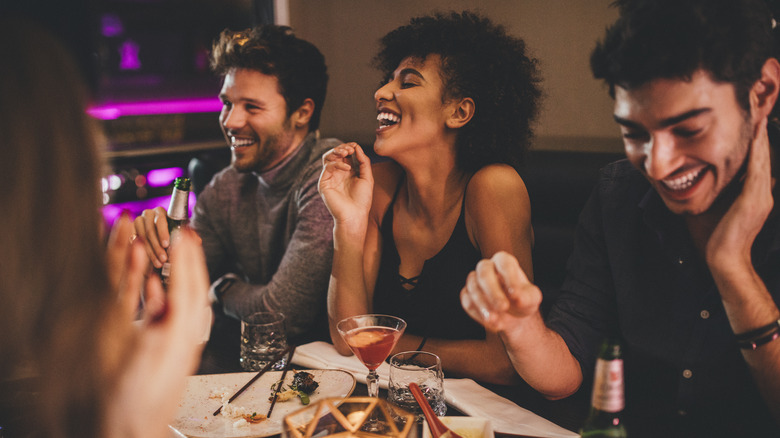 Laughing friends at restaurant