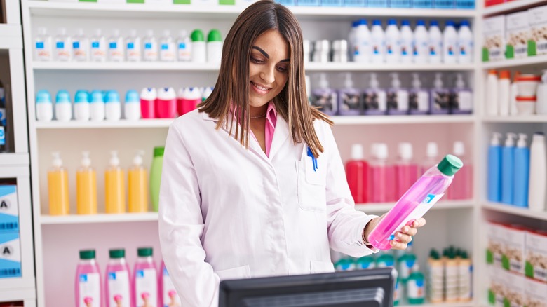 pharmacist with prescription shampoo