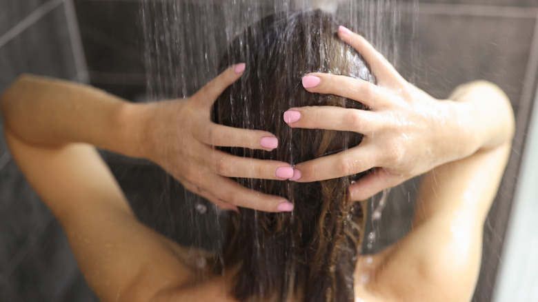 Woman shampooing her hair