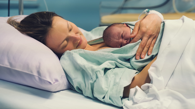 Woman holding her newborn baby