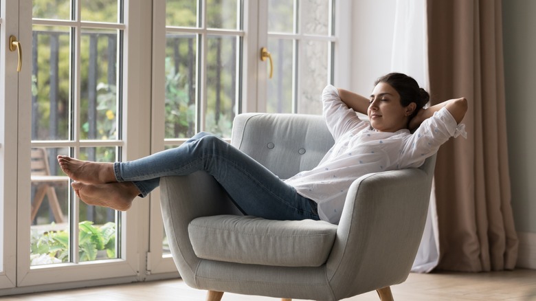 Woman kicked back in chair