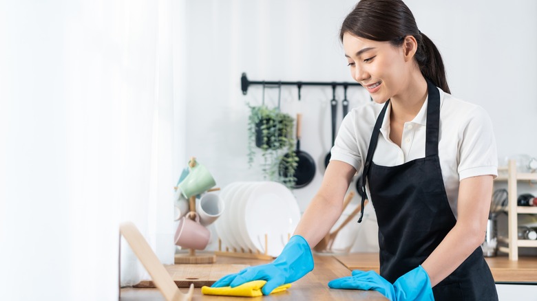 Woman using a household cleaner