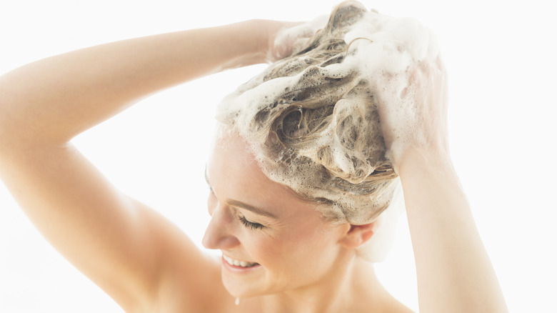 Woman in the shower washing hair