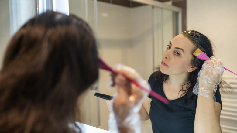 Woman coloring hair