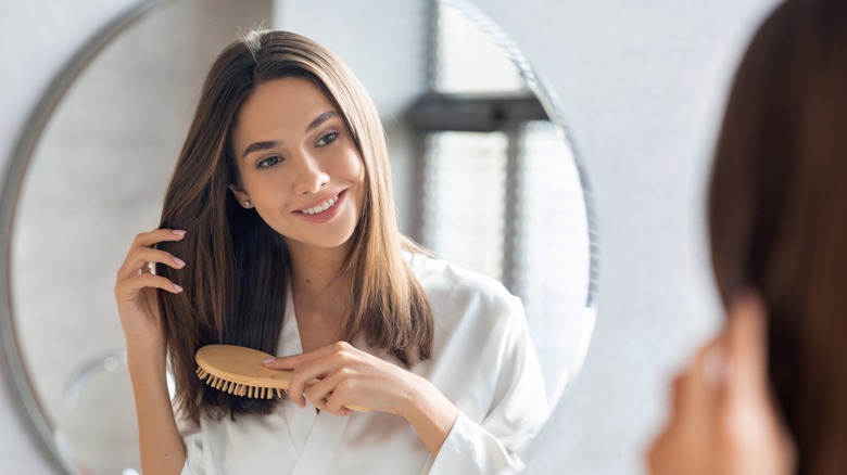 Woman looking in mirror