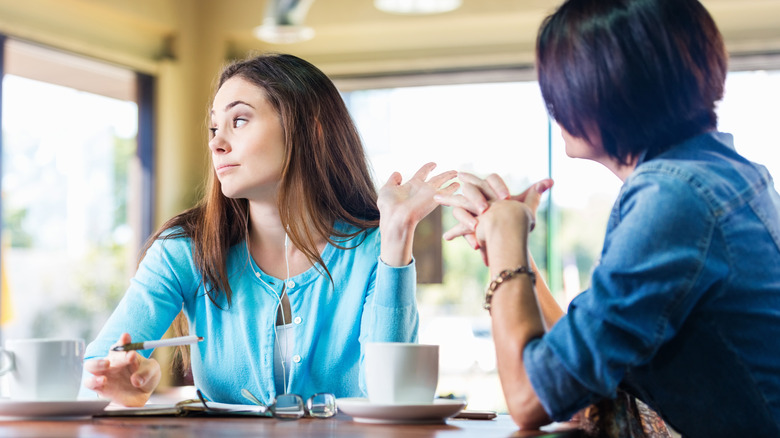 woman looking away during conversation