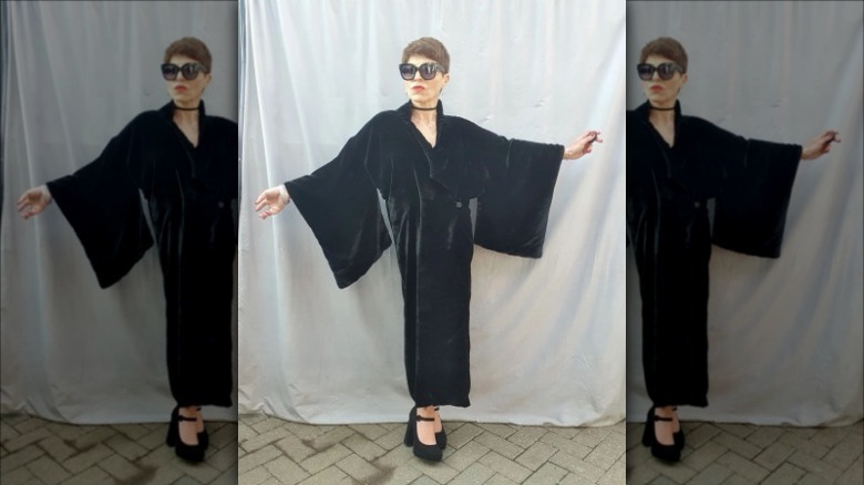 woman wearing black vintage duster coat