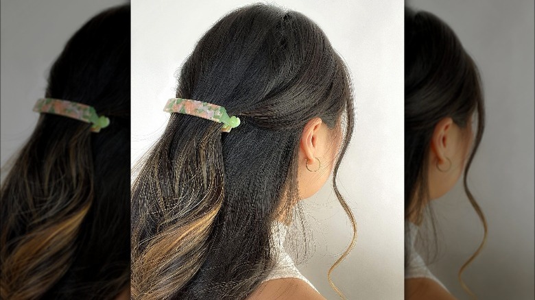 Person wearing floral banana clip