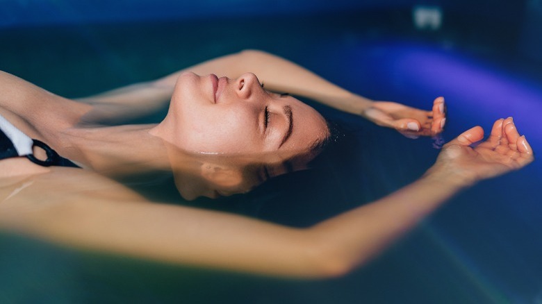 Woman in float therapy tank