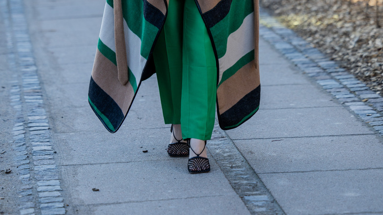 Person wearing black mesh shoes