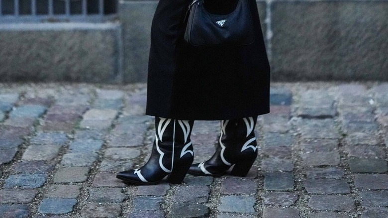 Person in black and white cowboy boots