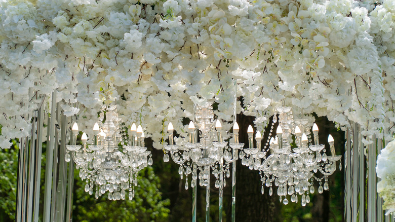 Hanging floral installation and chandeliers