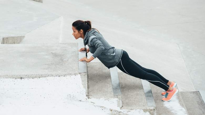 Woman doing an incline push up