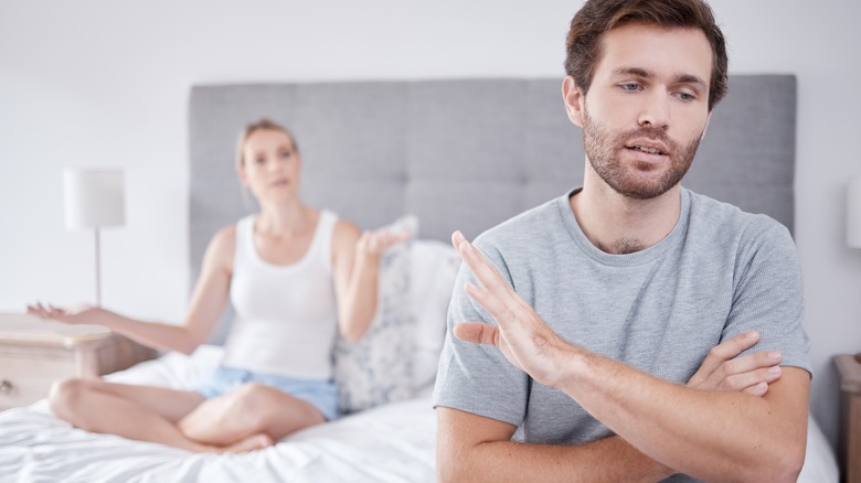 man saying no to partner in bed